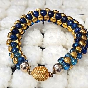 Vintage Marvel bracelet, blue lucite and gold metal.